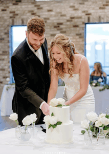 bride and groom cut their wedding cake